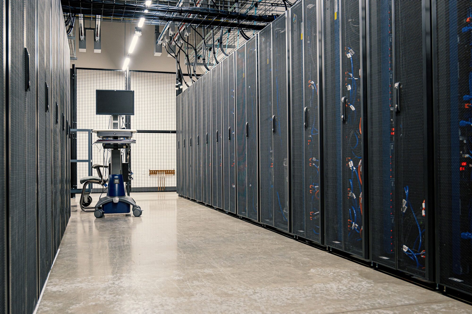 Corridor between server racks in a data hall